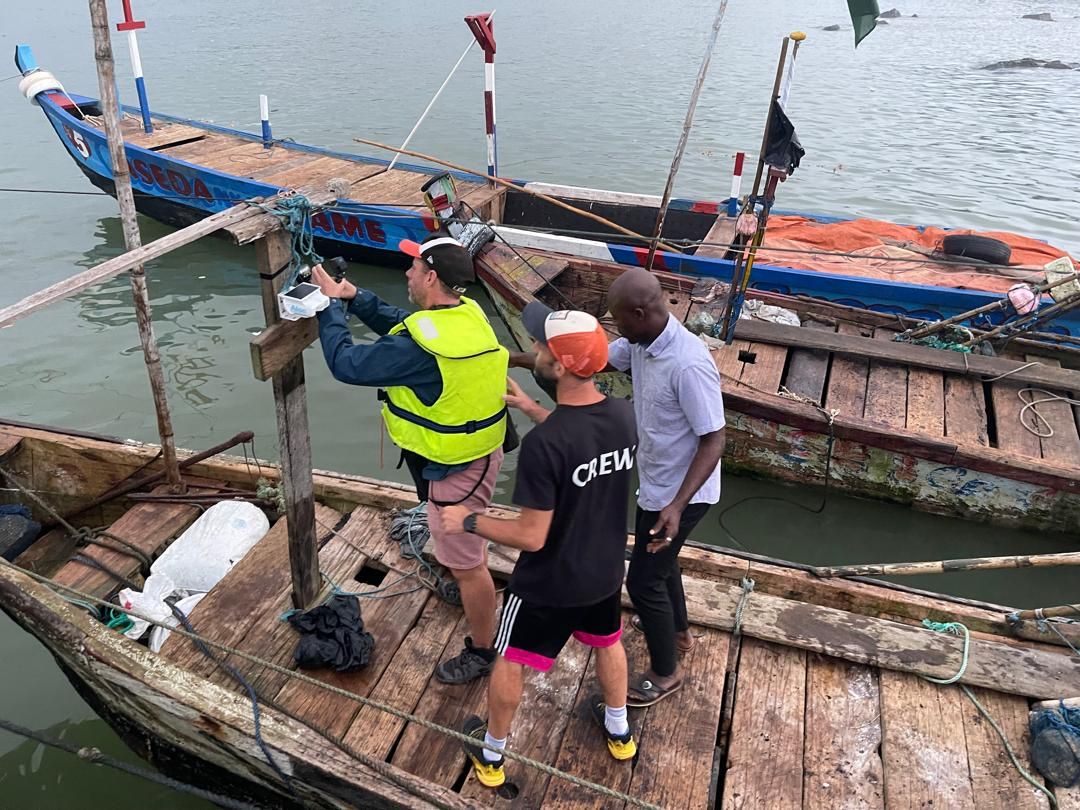 Crew and GRRMC team preparing to board a canoe for the fishing expedition in Dixcove